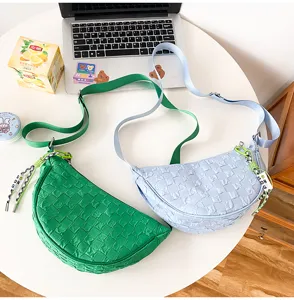 Detailed view of trendy nylon crescent shoulder bags with woven texture, casual and stylish daily wear.