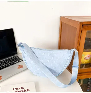 Light blue quilted nylon crescent crossbody bag, stylish casual dumpling shoulder bag for daily.