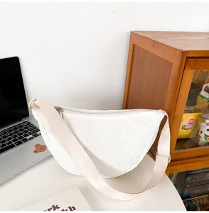 White nylon crescent shoulder bag with quilted pattern, casual crossbody bag for daily use.