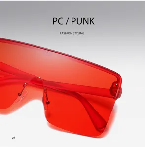 Lunettes de soleil sans monture surdimensionnées rouges, style punk pour femmes et hommes.