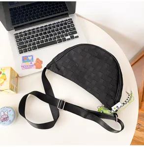 Black nylon crescent crossbody bag with adjustable strap, casual dumpling shoulder bag.