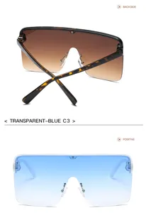 Lunettes de soleil oversize style masque avec design plat et verres dégradés de détail.