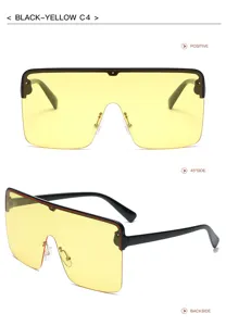 Lunettes de soleil oversize écran plat avec verres jaunes et monture noire pour le style tendance.