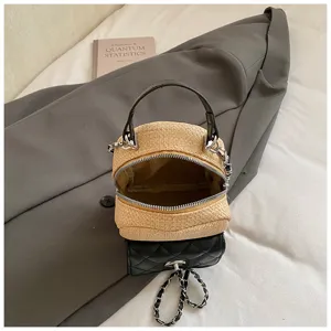 Woven straw and PU color block mini top handle crossbody bag for women chic details view.