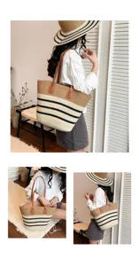 Woven straw tote bag detail showing black stripes and brown leather handles for summer beach use.