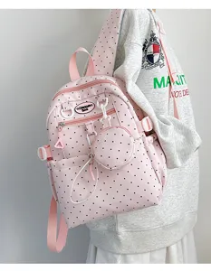 Charmant sac a dos rose a pois pour les etudiants, ideal pour les loisirs quotidiens.