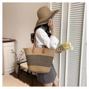 Chic straw woven tote bag for women, stylish striped beach shoulder bag with leather straps.