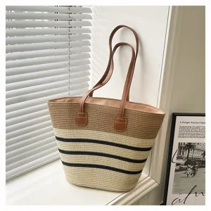 Detail shot of a stylish straw woven striped tote bag, perfect for beach vacation and daily use.