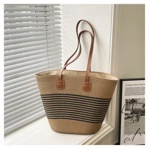 Detailed view of the woven striped straw tote bag, casual beach shoulder bag for women.