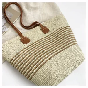 Stylish straw woven tote bag for women, large capacity casual shoulder bag for beach vacation.