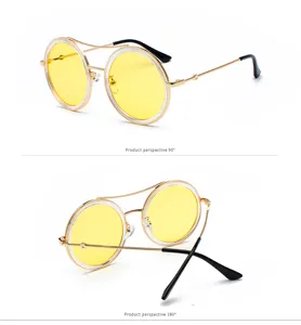 Gafas de sol redondas de metal retro con lentes amarillas y un elegante doble puente.