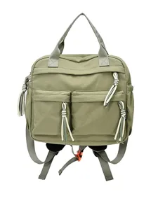 Sac à dos décontracté en nylon vert pour femme, cartable minimaliste avec poches avant.