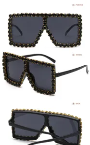 Occhiali da sole quadrati oversize con strass neri, vista di dettaglio moda chic ed elegante.