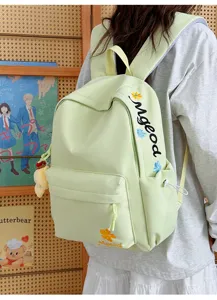 Close-up detail view of the stylish nylon school backpack with cute letter embroidery.