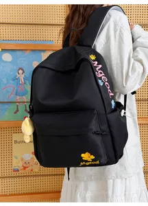Black nylon school backpack for girls, large capacity casual bookbag with embroidery details.