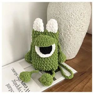Handmade crochet cute monster shoulder phone bag, stylish cartoon crossbody bag for women.