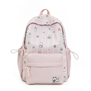 Close-up detail of the cute white dog print and pink pocket on this Japanese style backpack.