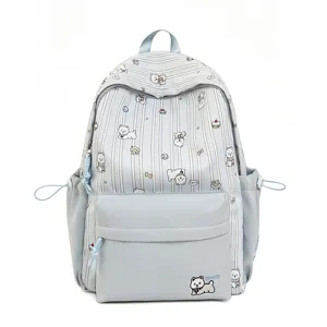 Close-up detail view of the cute dog printed canvas backpack showing front pocket and pattern.