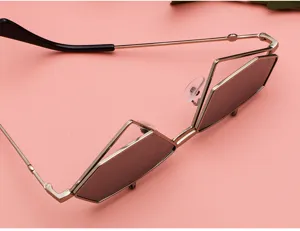 Close-up detail view of trendy metallic flip-up sunglasses, unique geometric frame design.