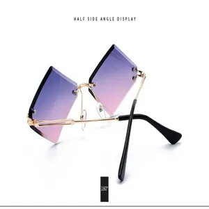 Rimless gradient sunglasses detail view, showcasing the unique polygon purple lenses and gold frame.