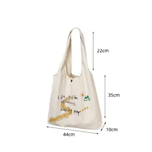 Canvas tote bag detail view, letter print design, spacious capacity and clear dimensions.