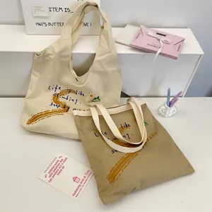 Canvas tote bag with letter print, casual large capacity shoulder bag for daily use.