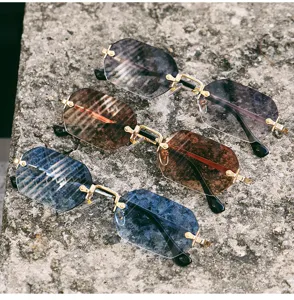Stylish polygon rimless sunglasses with gradient lenses and metal frames for street fashion.