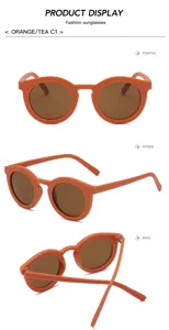 Stijlvolle matte oranje ronde zonnebril voor heren en dames, een trendy mode-accessoire voor de zomer.