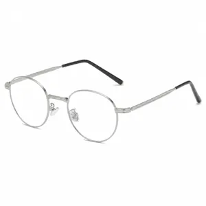 Retro metal round anti-blue light glasses for men and women, stylish optical clear eyewear.