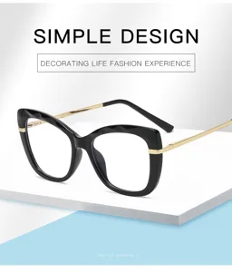 Lunettes anti-lumière bleue élégantes avec monture œil-de-chat et branches métalliques.