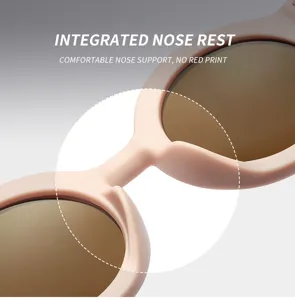 Detailed view of matte cream round sunglasses featuring a comfortable integrated nose rest design.