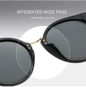 Vue détaillée de lunettes de soleil tendance pour femmes avec plaquettes nasales intégrées.