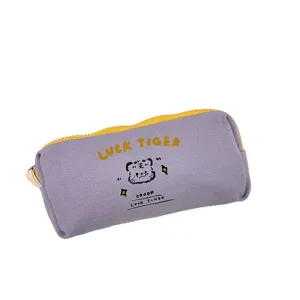 Purple canvas pencil case with cute tiger print and yellow zipper for stationery storage.