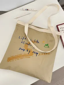 Canvas tote bag with letter print, large capacity casual shoulder bag for daily use.