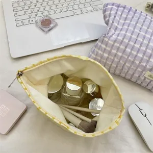 Chic plaid cosmetic bag for portable storage, stylish makeup pouch for daily travel essentials.