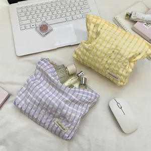 Detailed view of the cute plaid cosmetic bag, perfect for portable storage and daily travel.