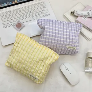 Detailed view of the cute plaid cosmetic bag, soft grid storage pouch for daily travel essentials.