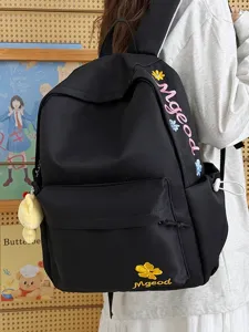 Black nylon student schoolbag with cute floral letter embroidery and large capacity for daily use.
