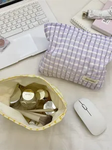 Stylish checkered cosmetic bag for women, portable toiletry pouch and makeup organizer.