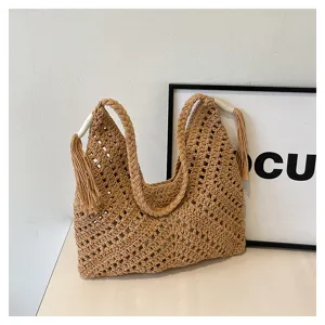 Hollow out woven straw tote bag for women, vintage beach shoulder bag with tassels.