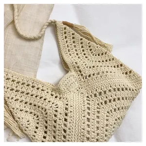 Handmade woven hollow women's commuting tote bag detail shot showing fine crochet texture.