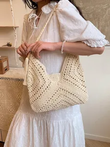 Beige crochet hobo shoulder bag, handmade hollow out straw tote for women beach vacation.