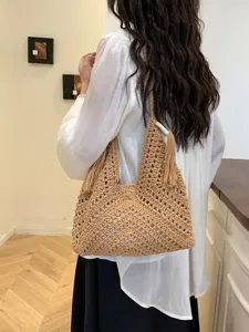 Woven crochet shoulder bag for women, stylish hollow out beach tote purse for daily commute.