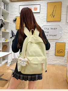 Mochila escolar de gran capacidad con bonito bordado de lazo, amarillo claro.