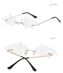 Transparent bat wing rimless sunglasses with gold metal frames for festival street style.