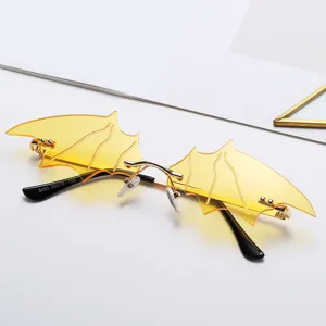 Bat wing rimless sunglasses yellow lens gold metal frame quirky fashion eyewear for women