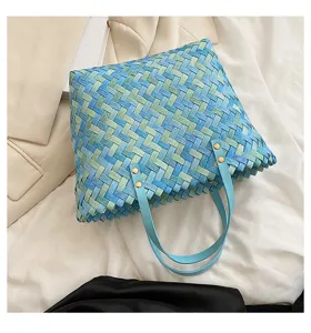 Blue green woven shoulder handbag detail, stylish straw tote bag with leather straps.