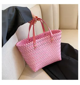 Pink woven straw tote bag detailed view, stylish women shoulder shopping handbag for spring.