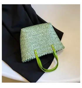 Light green straw woven women shopping bag, stylish single shoulder messenger bag for daily use.