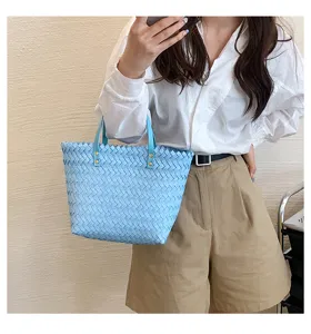 Chic light blue woven tote bag with leather handles, stylish casual shoulder daily handbag.